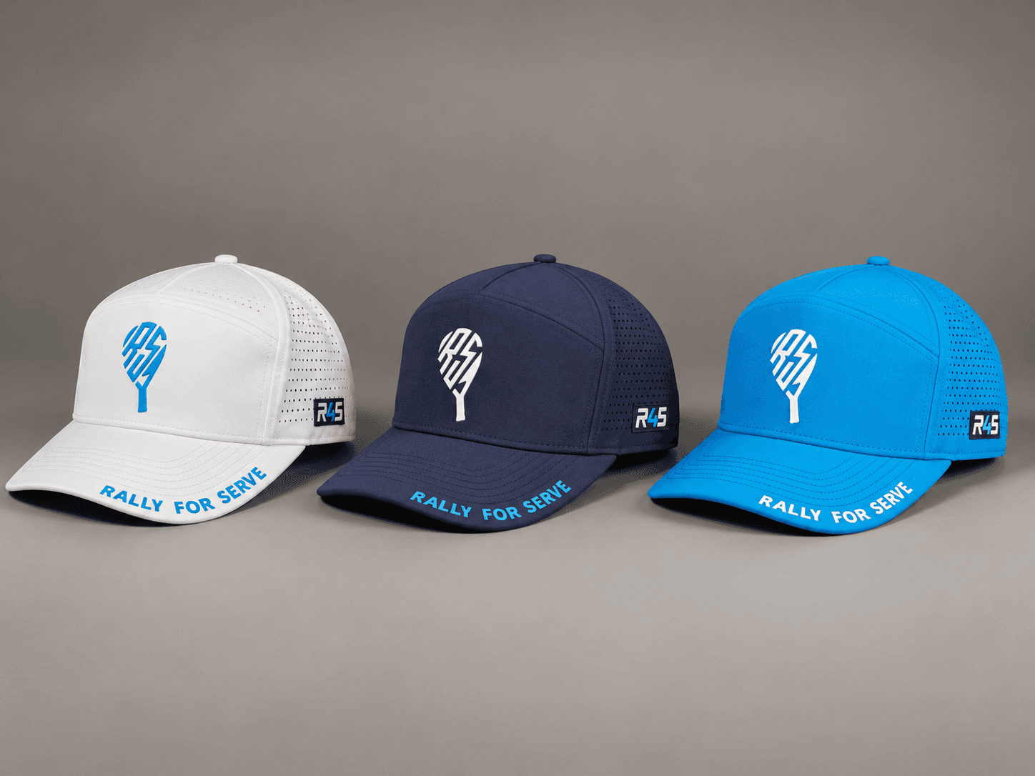 White, navy, and Rally blue court hat development colorways arranged side by side